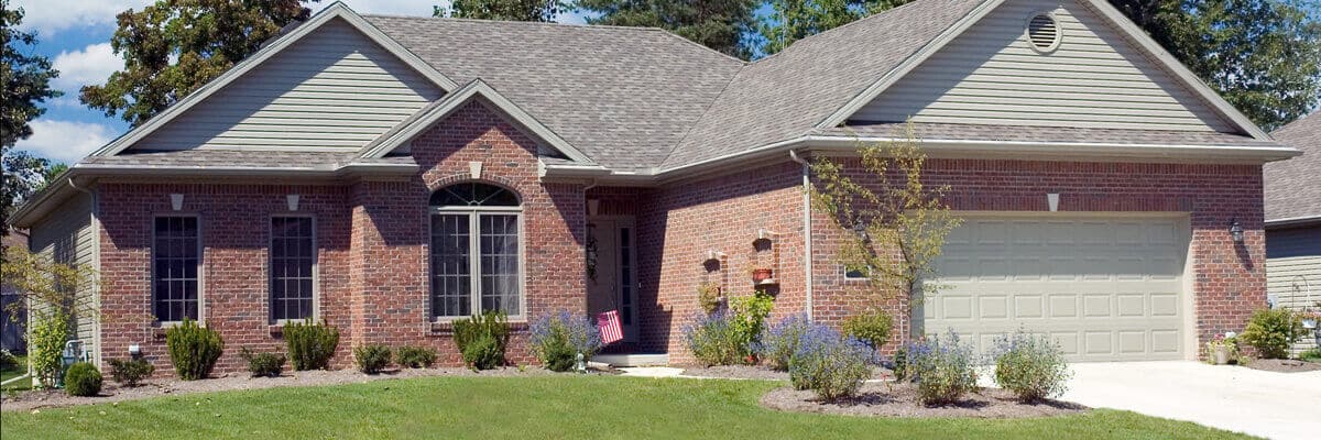 house-brick-driveway-lawn-garage